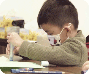 A nursery 2 (N2) student doing classwork during an enrichment class at The Learning Lab